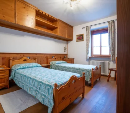 Camera doppia accogliente in stile montano nell’appartamento Mortisa a Cortina